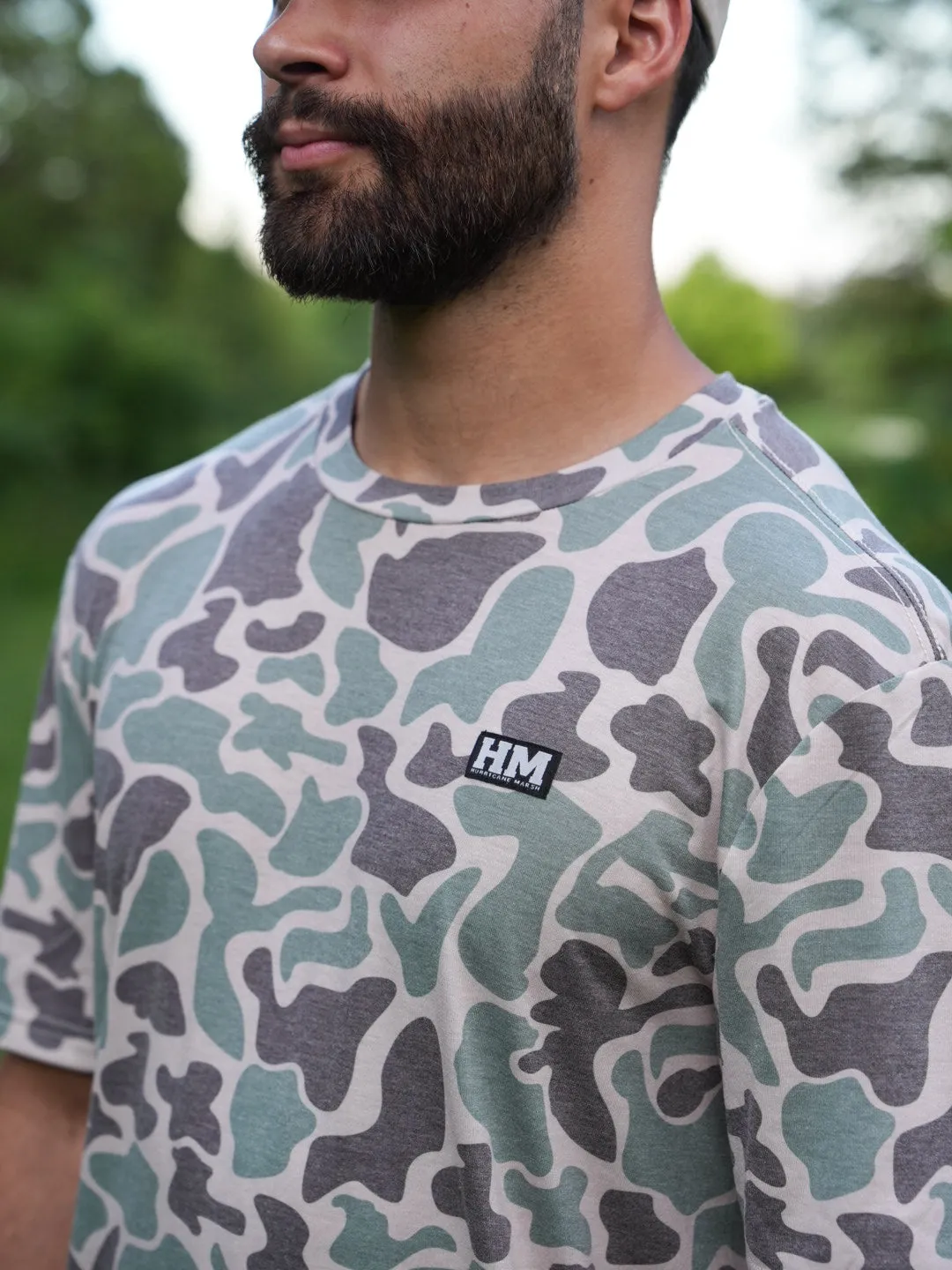 The Marsh Green Camo Migrator Performance Tee